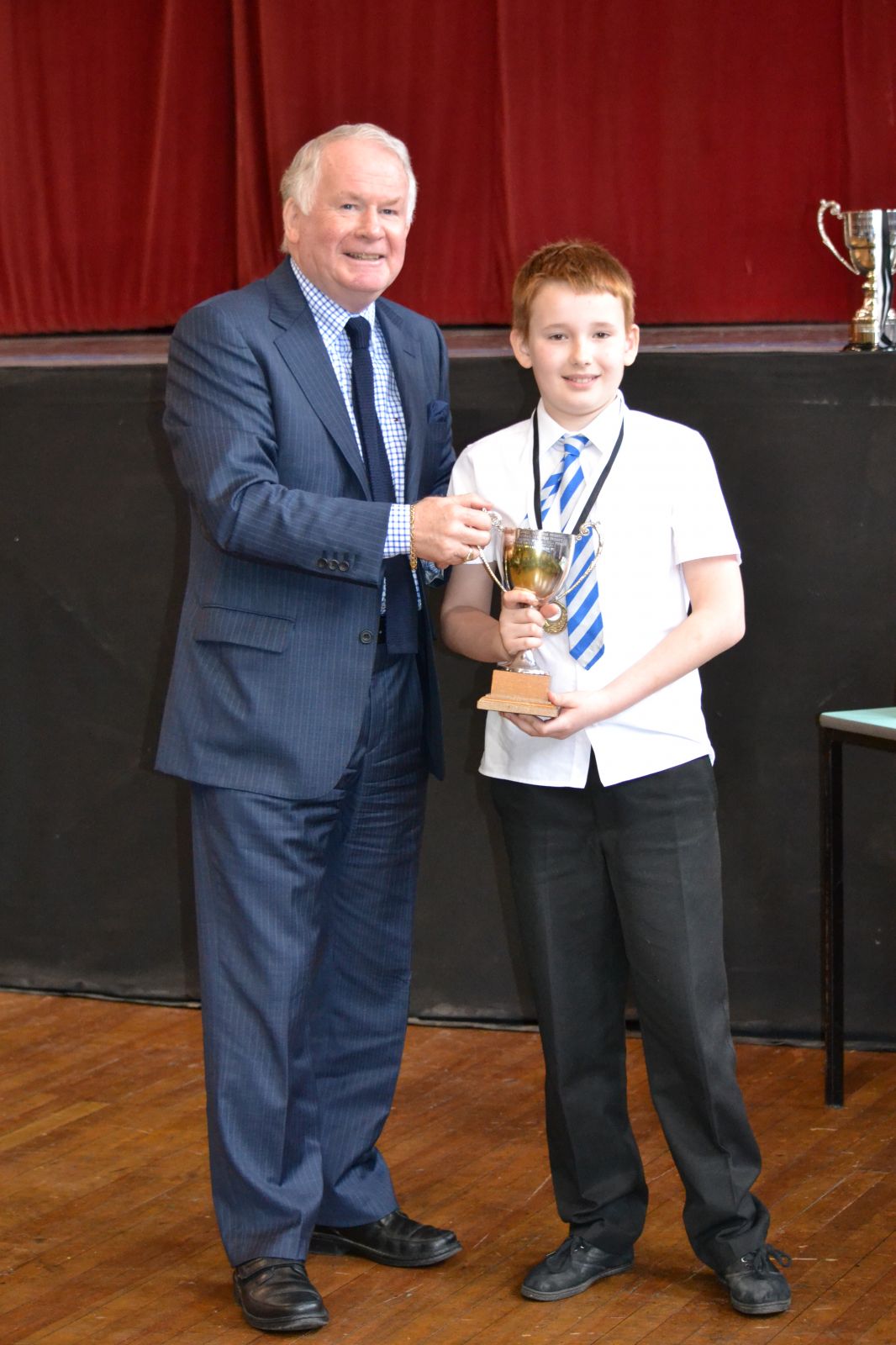 Class 16 winner Troy Barbour from Sanquhar primary with adjudicator Brian Marjoribanks