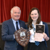 Class 8 Adjudicator Brian Marjoribanks presents trophy to winner Elspeth Nicholson Wallace Hall Academy
