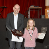 Millie Hird with adjudicator Wayne Robertson receiving the Castle Douglas Accordion and Fiddle Club Shield (Under 10 Fiddle Solo)<br/><a href="gallery/2016-accordion-and-fiddle/853/add/#comments">Add comment</a>